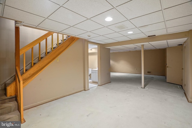 basement featuring a paneled ceiling