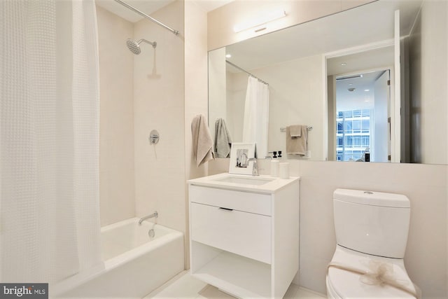 full bathroom with shower / bath combo, vanity, and toilet