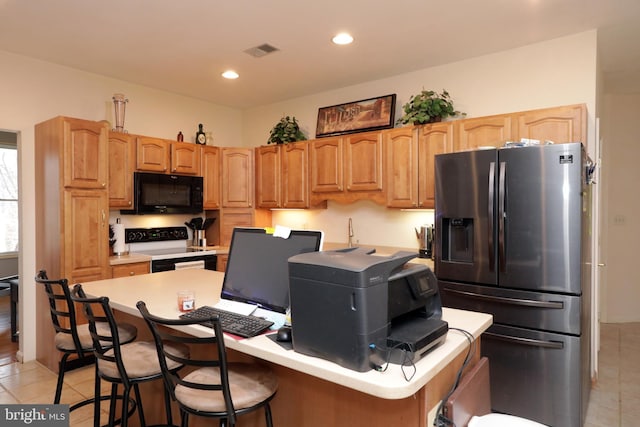 kitchen featuring a kitchen bar, range, light tile patterned floors, stainless steel fridge with ice dispenser, and a center island