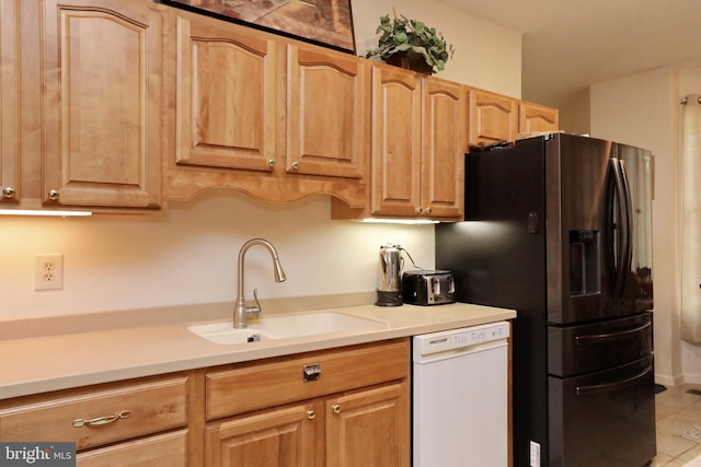 kitchen featuring dishwasher, light tile patterned floors, sink, and stainless steel refrigerator with ice dispenser