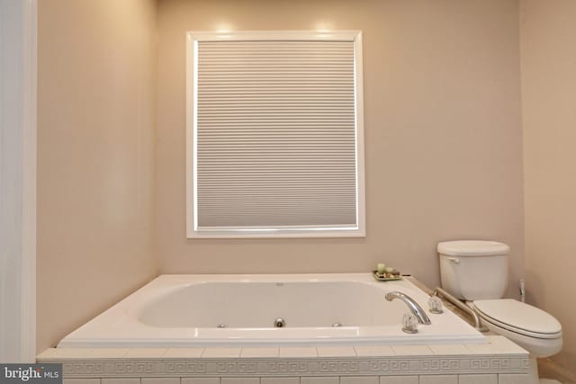 bathroom with tiled bath and toilet