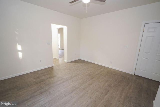 unfurnished room with hardwood / wood-style floors and ceiling fan