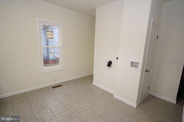 washroom with hookup for a washing machine, light tile patterned floors, and electric dryer hookup