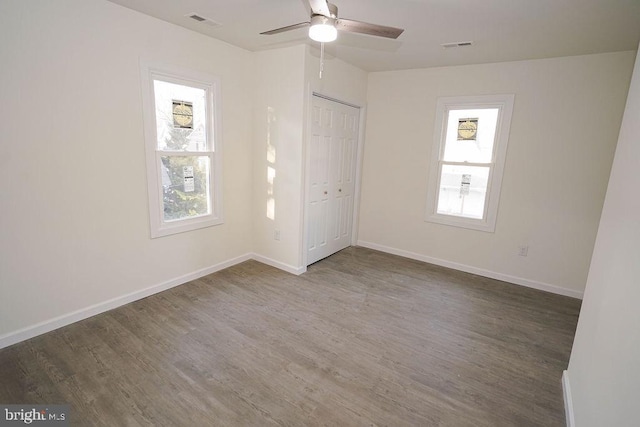 spare room featuring hardwood / wood-style floors and ceiling fan