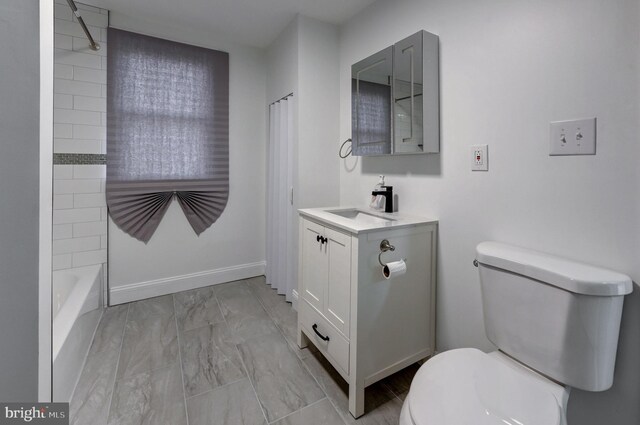 full bathroom with tiled shower / bath combo, tile patterned floors, toilet, and vanity