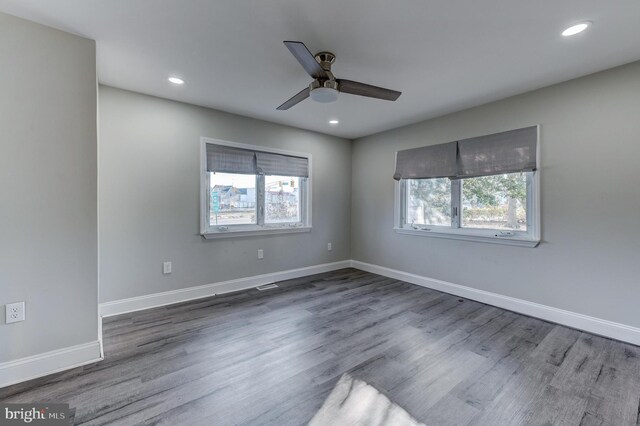 unfurnished room featuring hardwood / wood-style floors and ceiling fan