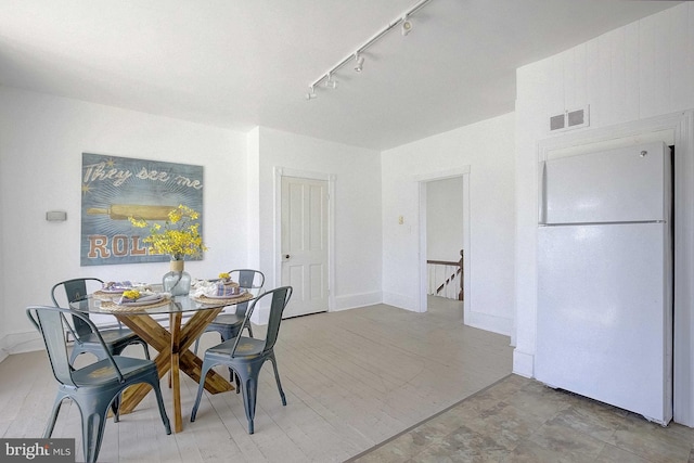 dining room with track lighting