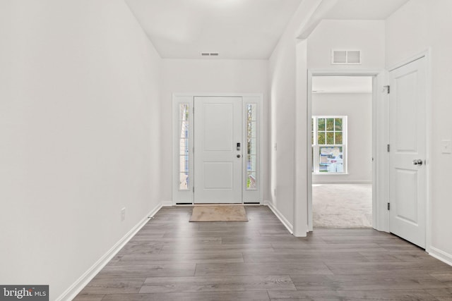 entryway with light hardwood / wood-style floors