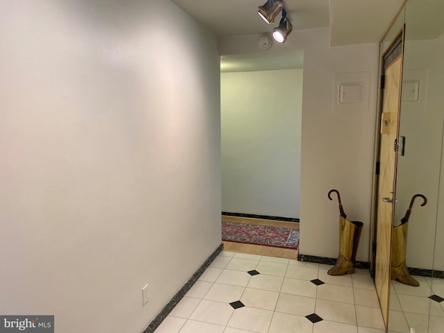 hallway with light tile patterned floors