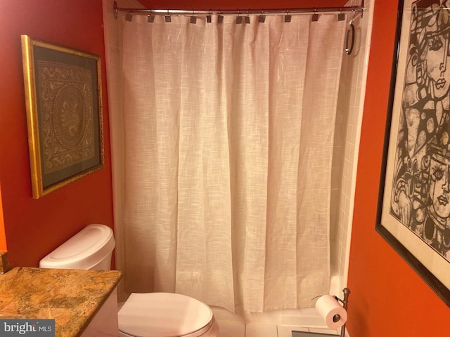 bathroom featuring toilet and vanity