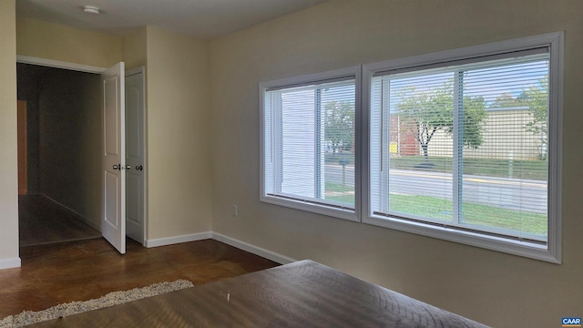 unfurnished room featuring plenty of natural light