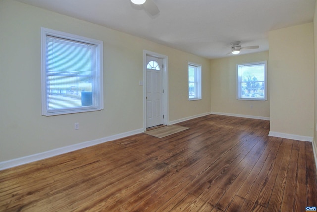 foyer entrance featuring ceiling fan and dark hardwood / wood-style flooring