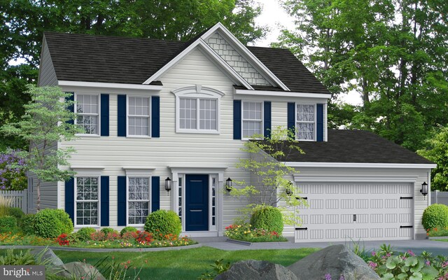 colonial inspired home with concrete driveway, a garage, and roof with shingles