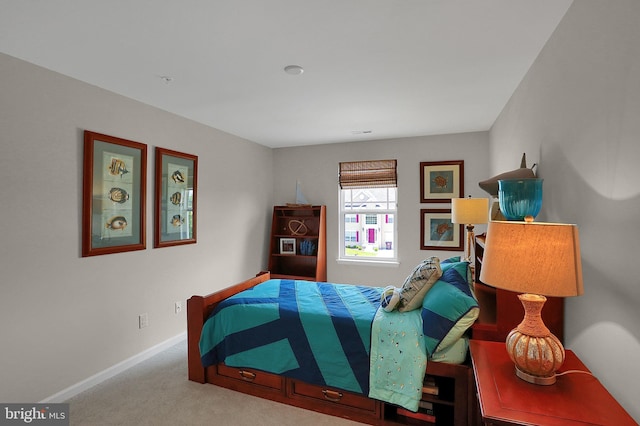 carpeted bedroom with baseboards