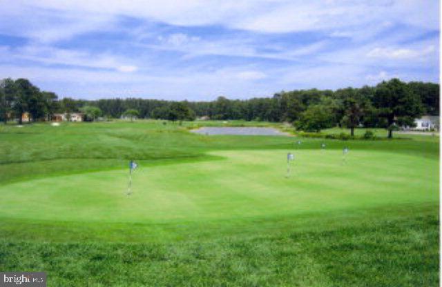 view of property's community with view of golf course