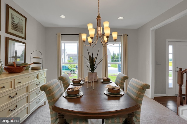dining area featuring a wealth of natural light, recessed lighting, and an inviting chandelier