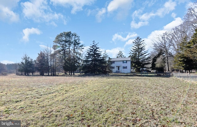 view of yard with a rural view