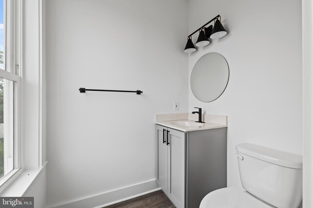 kitchen with pendant lighting, white cabinetry, sink, and appliances with stainless steel finishes