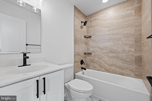 full bath with vanity, shower / tub combination, and toilet