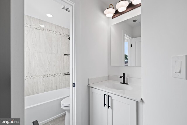 kitchen with white cabinets, a center island, stainless steel appliances, and hanging light fixtures