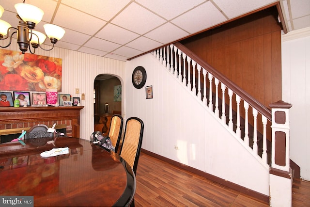 dining space with a chandelier and dark hardwood / wood-style flooring