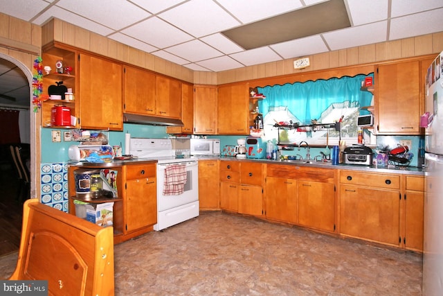 kitchen with white appliances and sink