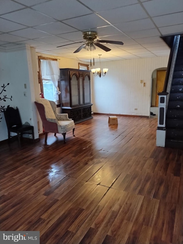 unfurnished room featuring dark hardwood / wood-style flooring, a paneled ceiling, and ceiling fan