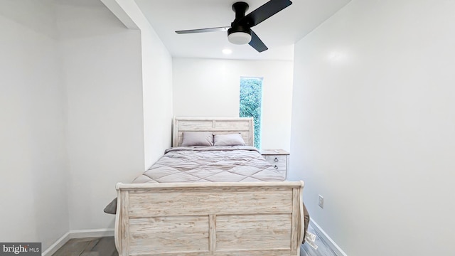 bedroom with wood-type flooring and ceiling fan