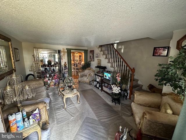 living room with a textured ceiling