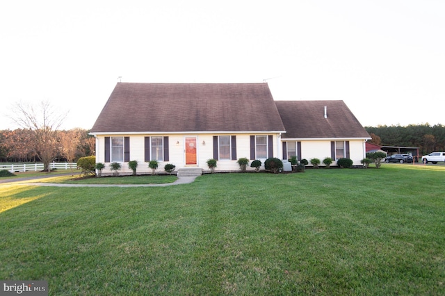 cape cod house with a front lawn