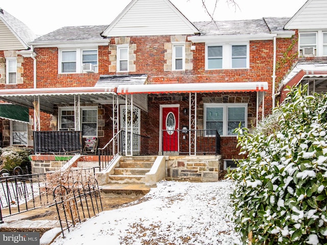 view of property featuring covered porch