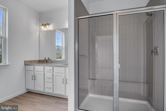 bathroom with vanity and an enclosed shower