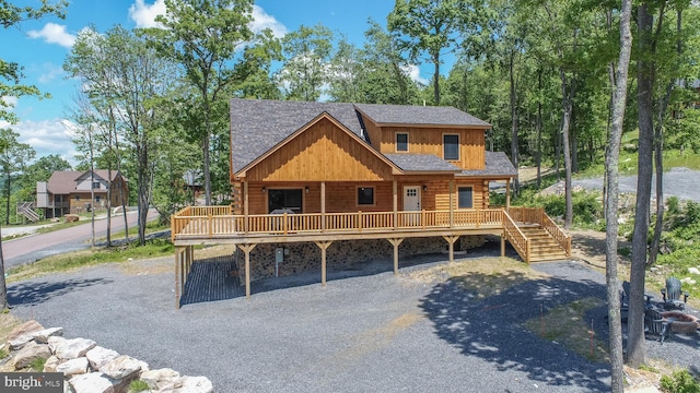 log cabin featuring a carport