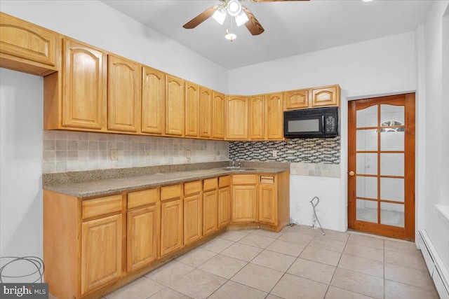 kitchen with ceiling fan, tasteful backsplash, light tile patterned floors, and baseboard heating