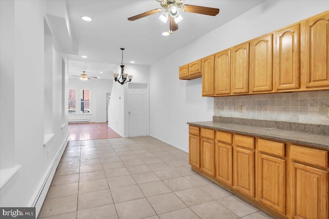 kitchen featuring light hardwood / wood-style floors, a baseboard radiator, ceiling fan, and backsplash