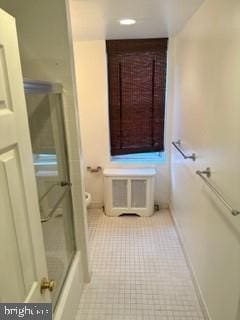 bathroom featuring tile patterned floors and toilet