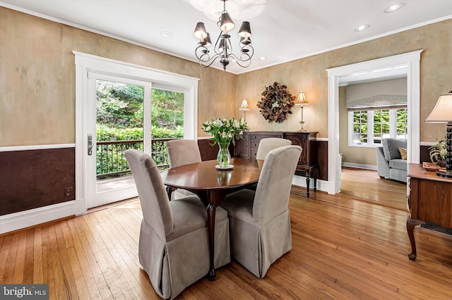 dining space featuring recessed lighting, baseboards, a notable chandelier, and light wood-style flooring