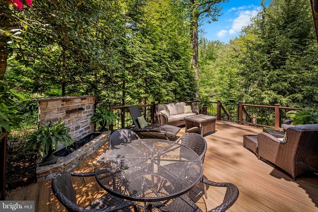 deck featuring an outdoor hangout area and outdoor dining area