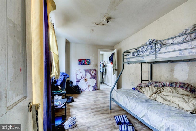 bedroom featuring ceiling fan and wood-type flooring