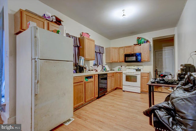 kitchen with white appliances, wine cooler, and light hardwood / wood-style flooring