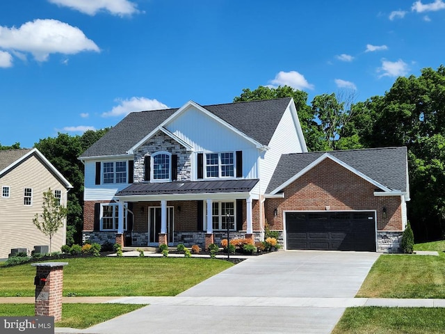 view of front facade with cooling unit, covered porch, a front yard, and a garage