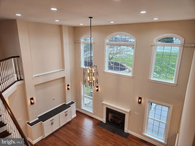 living room featuring dark hardwood / wood-style flooring and a notable chandelier