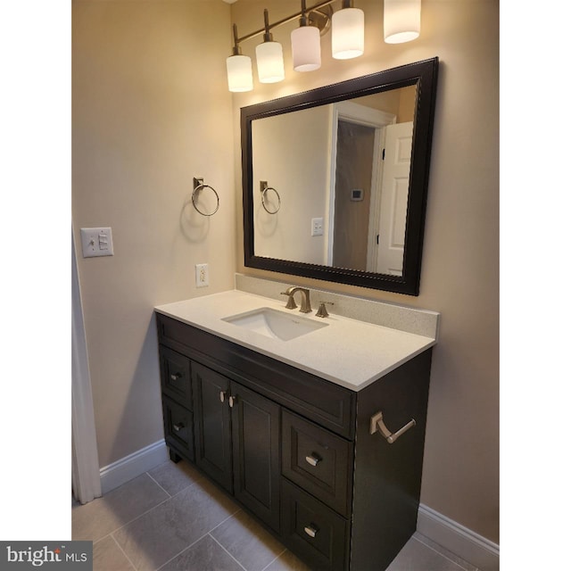 bathroom featuring tile patterned flooring and vanity