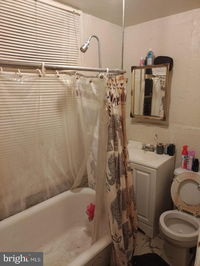 full bathroom featuring shower / bath combo, toilet, and sink