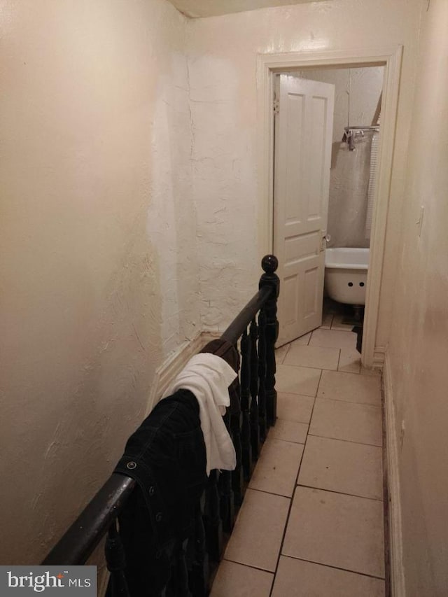 hallway featuring light tile patterned flooring