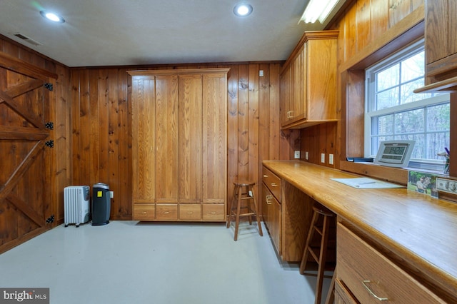 bar featuring wood walls and radiator heating unit