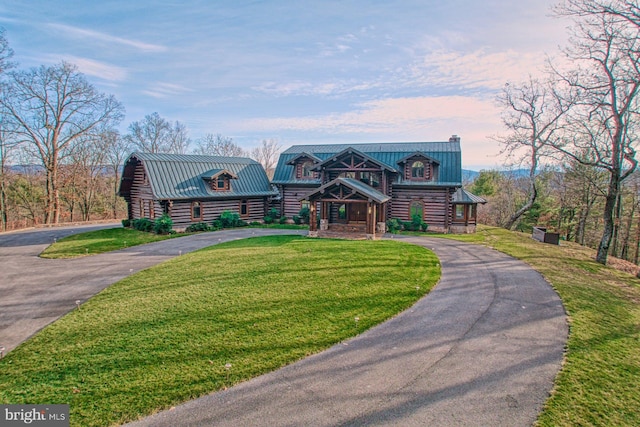 cabin with a lawn