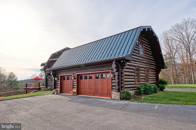 view of side of property with a garage