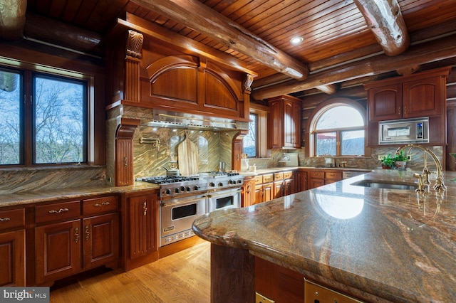 kitchen featuring beam ceiling, sink, stainless steel appliances, wooden ceiling, and light hardwood / wood-style floors