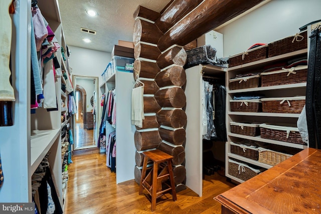 spacious closet featuring light wood-type flooring